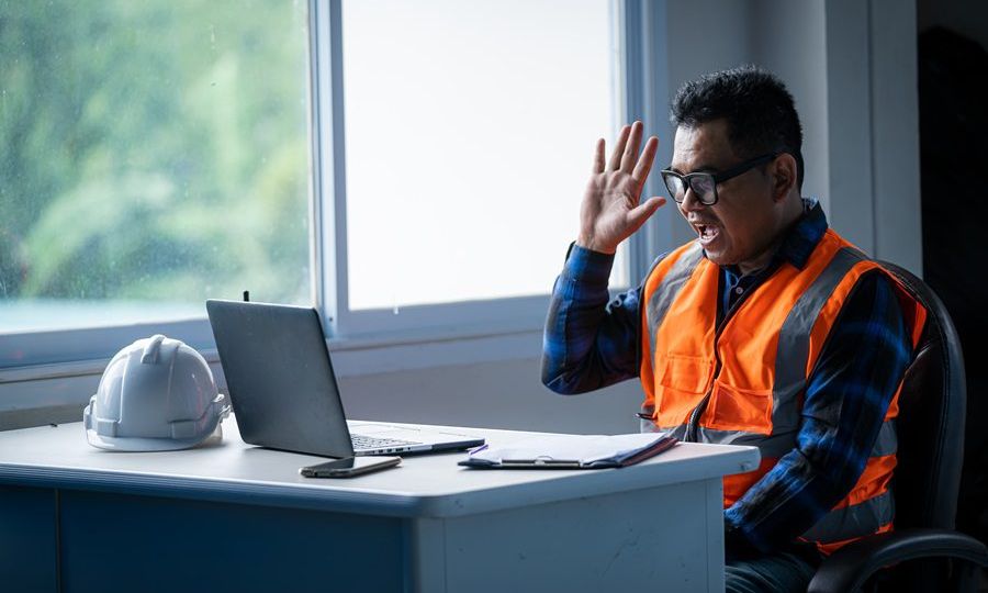 Engineer working with laptop computer in builders at constructio