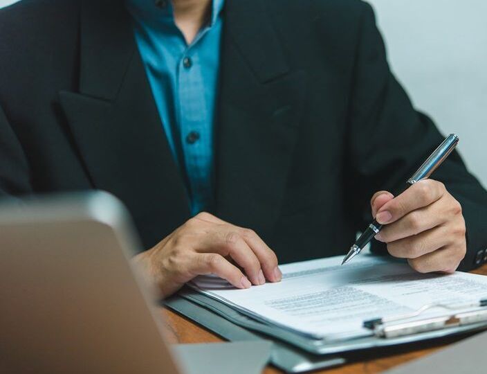 businessman agree to make deal signing document, sale contract, employment job or legal transaction contract at desk